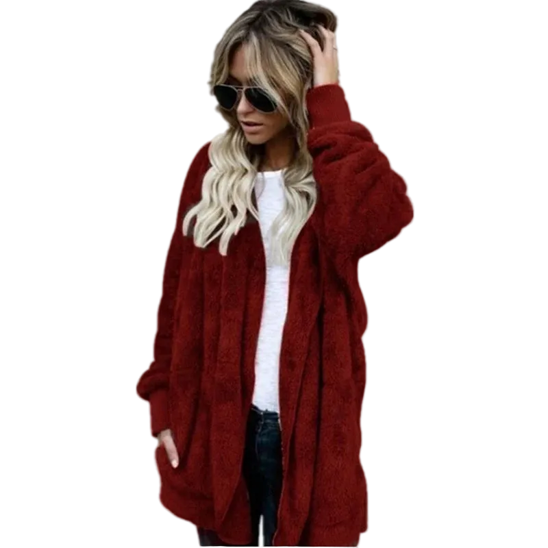 Woman wearing a red cardigan on a white background