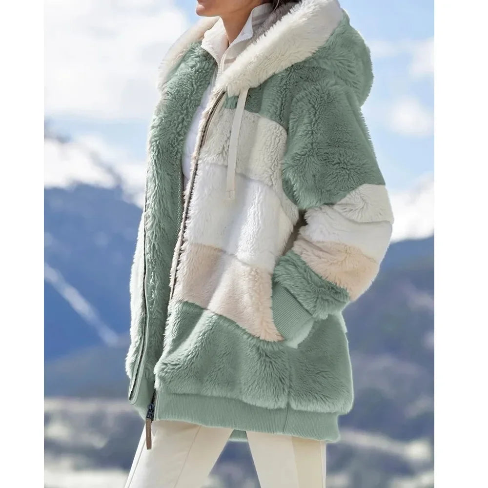 Green and white sherpa jacket with mountain background