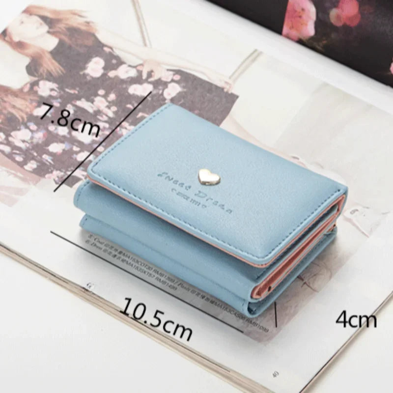 Light blue wallet with measurements on a floral background