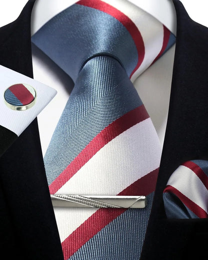 Striped tie with matching pocket square and cufflinks on a mannequin.