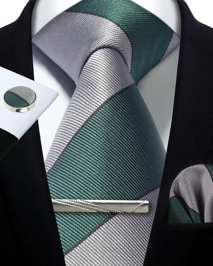 Green and gray striped tie with matching cufflinks on a black background