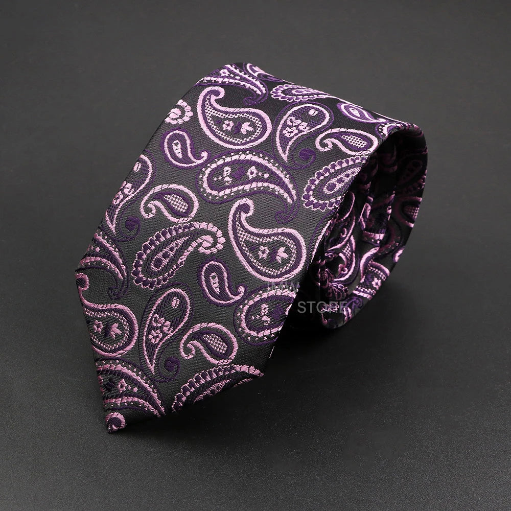 Purple paisley patterned tie on a dark gray background